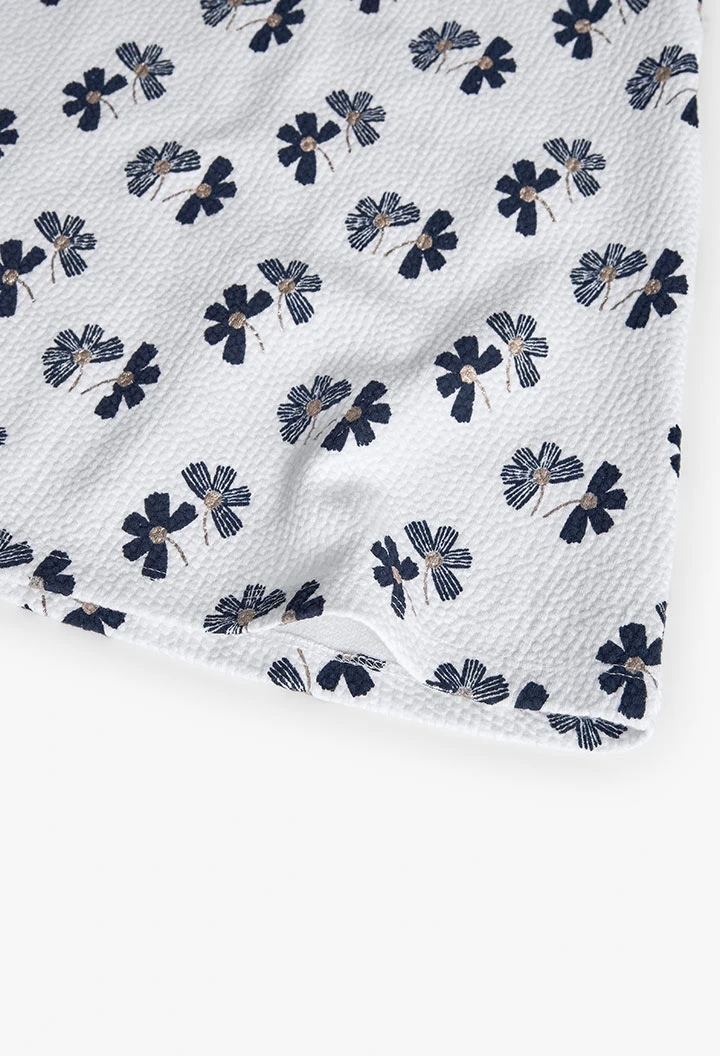 Vestido de malha para menina com design de flores em branco e preto.