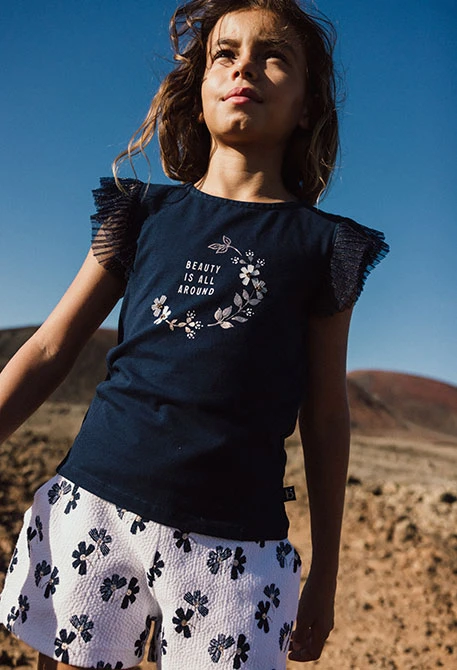 Calções de malha para menina com estampado de flores em branco e azul