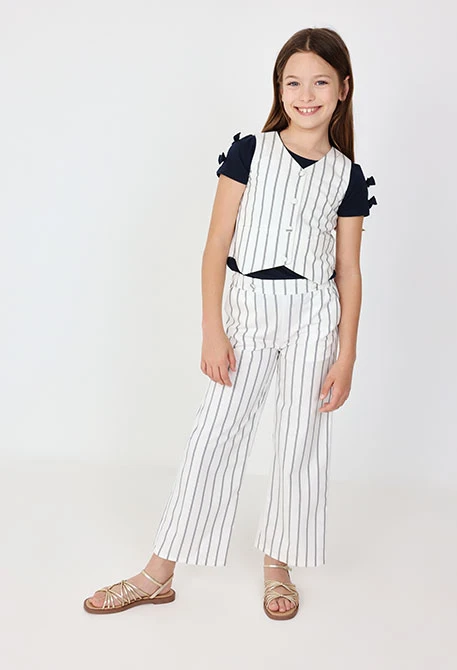 Pantaloni in maglia per bambina a righe in bianco e nero