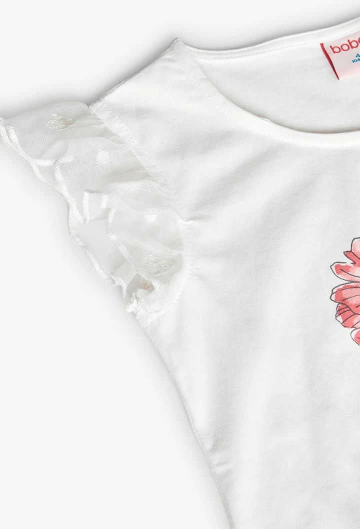 T-shirt en tricot pour fille en blanc avec motif de fleurs.