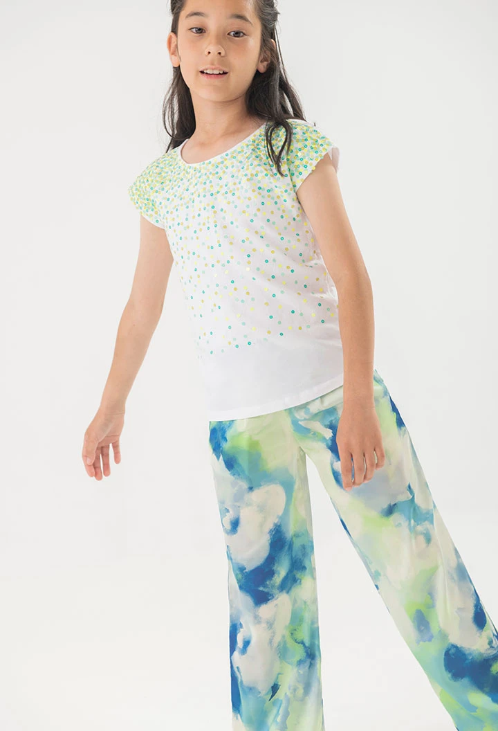 Calças largas de cetim para menina com estampado em azul e verde