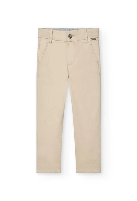 Pantaló de setí per a nen en color beige.