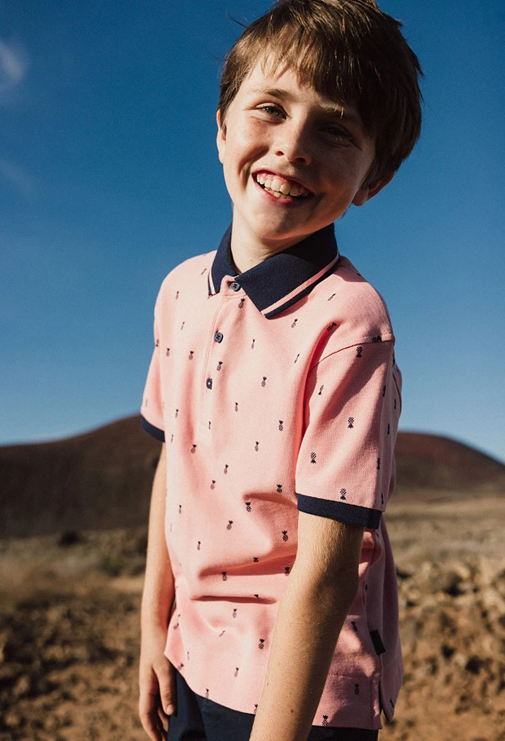 Polo en piqué pour enfant avec imprimé en couleur rose.