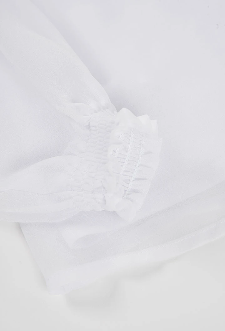 White blouse with frill collar