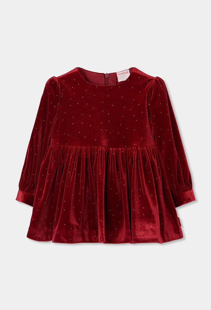 Robe en velours rouge avec reflets dorés