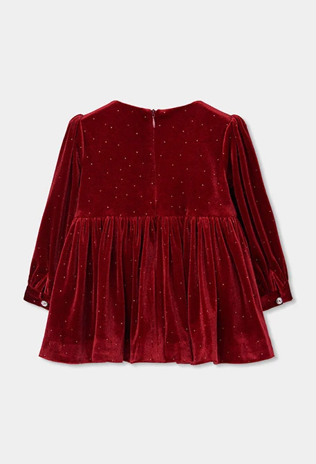 Robe en velours rouge avec reflets dorés