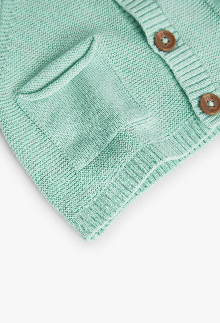 Casaco tricotado de bebé em verde