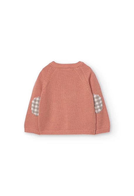 Pull en tricot pour bébé garçon de couleur orange.