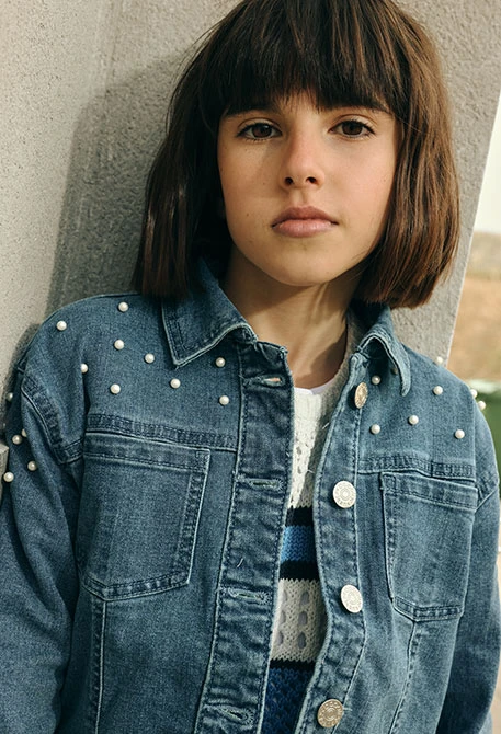 Girls? denim jacket in bleach colour with little bows