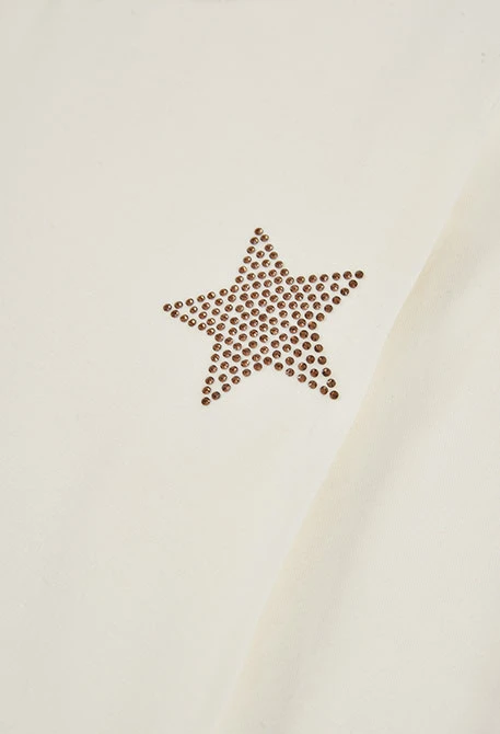 Maglietta in maglia da bambina bianca con stelle