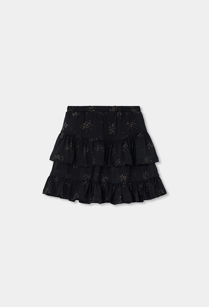 Faldilla de punt negra estampada amb estrelles i volants