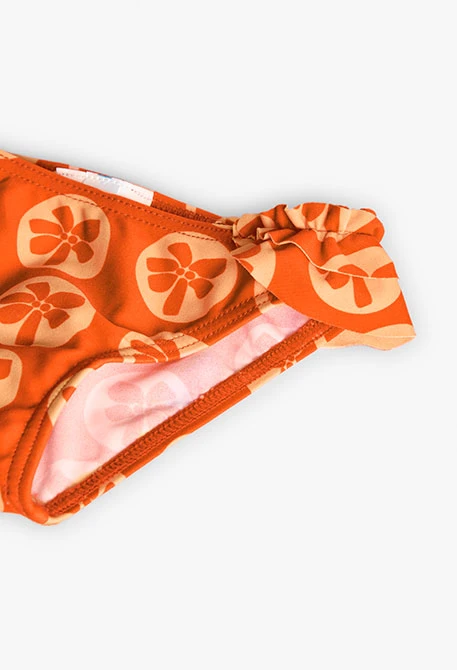 Cueca de banho de poliamida para bebé menina com estampado em cor laranja.
