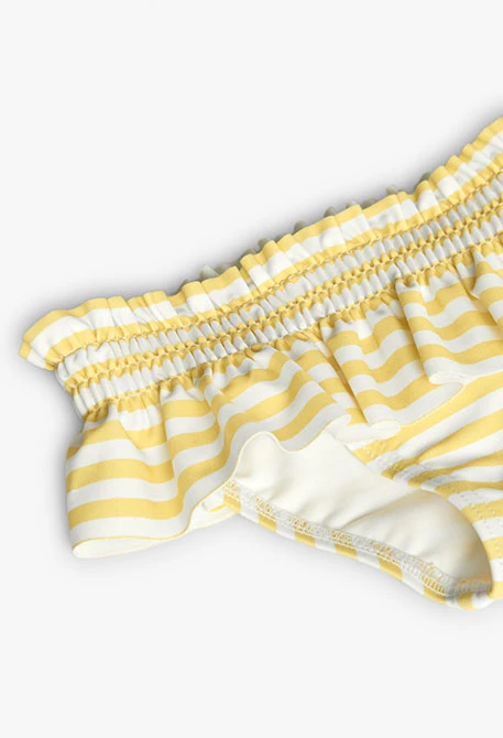 Costume slip in poliammide per neonata a righe gialle e bianche.