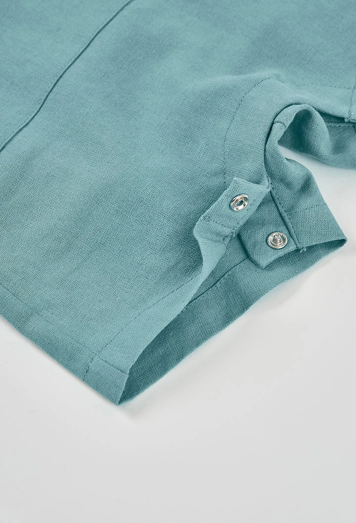 Babysatz mit grünem Poloshirt und Latzhose