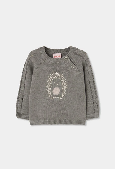 Grünes Strickpullover für Baby mit Igel-Stickerei