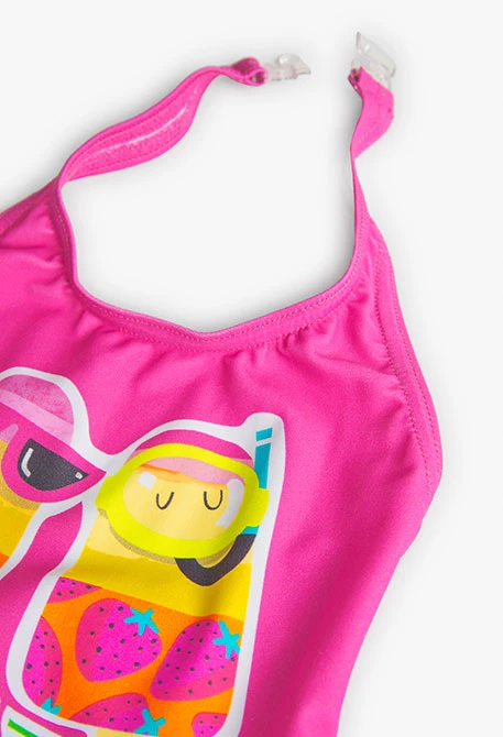 Baby girl's ruffled swimsuit in fuchsia colour