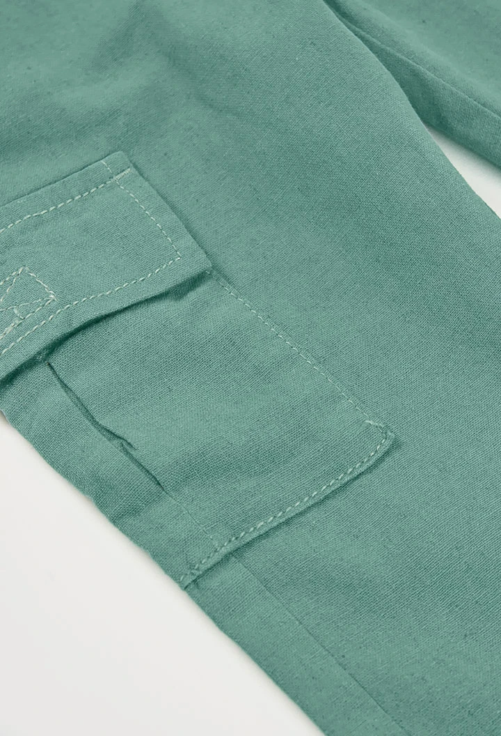 Green linen trousers for children