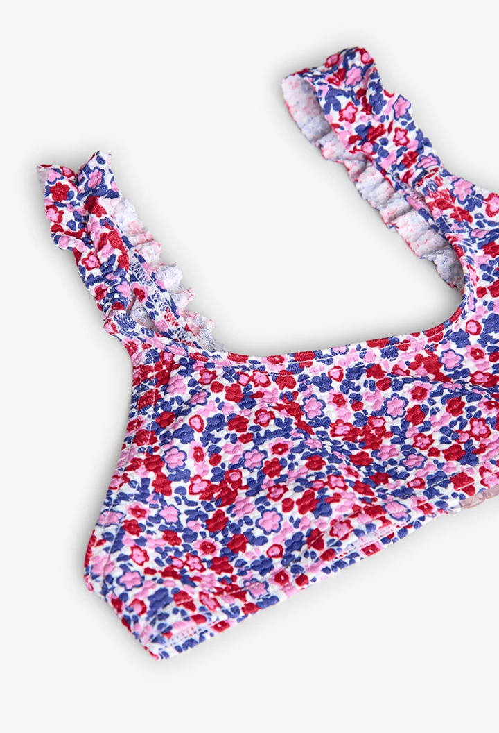 Polyamide bikini for girls with a floral print in red and blue.