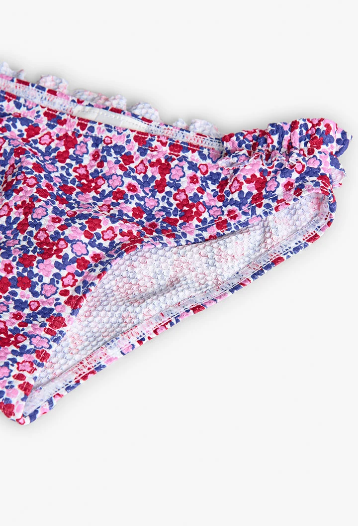 Polyamide bikini for girls with a floral print in red and blue.