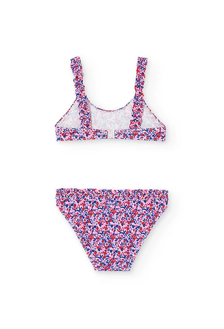 Polyamide bikini for girls with a floral print in red and blue.