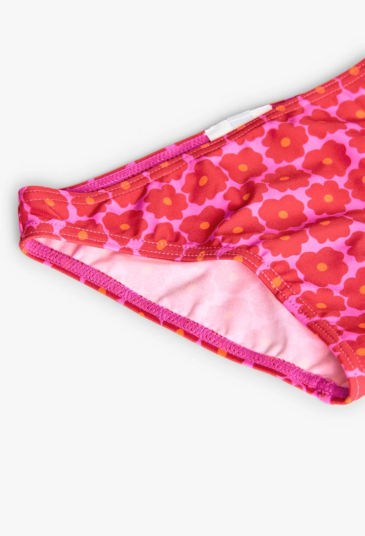 Bikini in poliammide per bambina con stampa floreale di colore rosa.