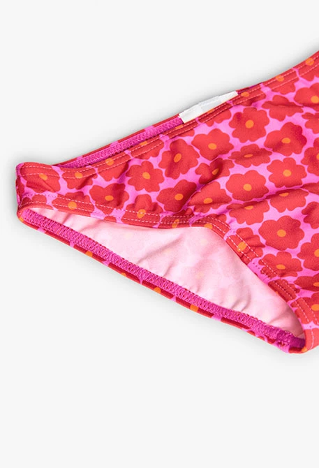 Bikini in poliammide per bambina con stampa floreale di colore rosa.