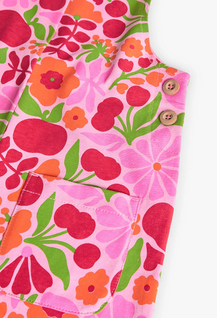 Tuta in maglia per bambina con design floreale in rosa e verde.