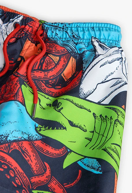 Costume da bagno per bambino in tessuto riciclato di colore blu marino.