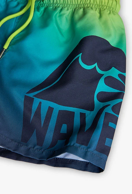 Costume da bagno in tessuto riciclato per bambino in colore blu marino.