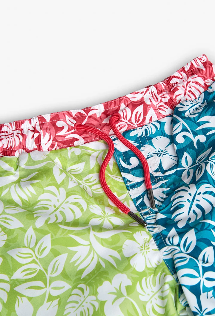 Boy\'s swimming trunks in recycled fabric, green with floral design.