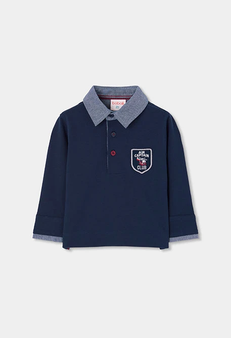 Polo garçon bleu marine avec écusson Air Captain Club
