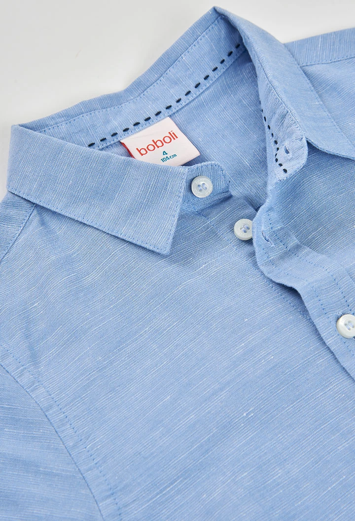 Light blue linen shirt for child.