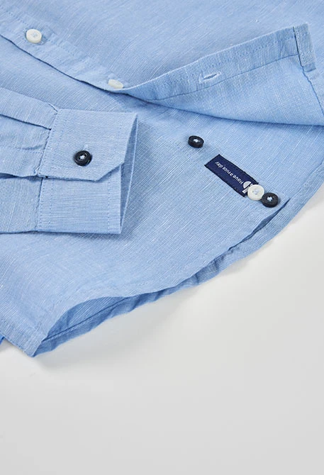 Light blue linen shirt for child.
