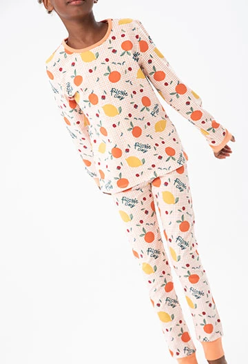 Knitted pyjamas for girls in orange print