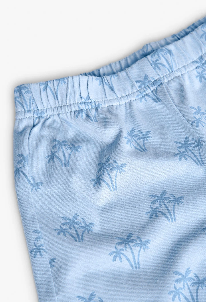 Pigiama corto in maglia per bambino con stampa in colore blu.